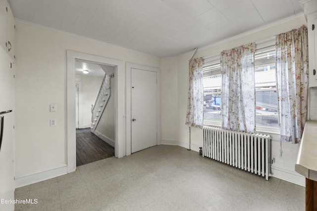 20 Summer St, Lee, MA 01238 - empty room with crown molding, tile patterned floors, stairs, radiator, and baseboards