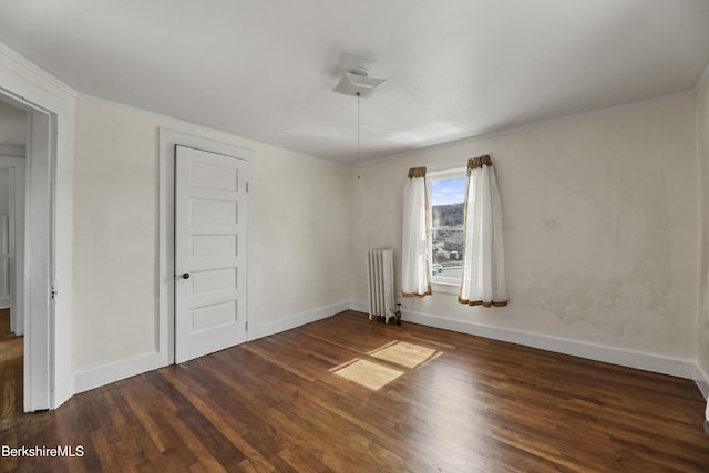 20 Summer St, Lee, MA 01238 - spare room featuring radiator heating unit, ornamental molding, baseboards, and wood finished floors