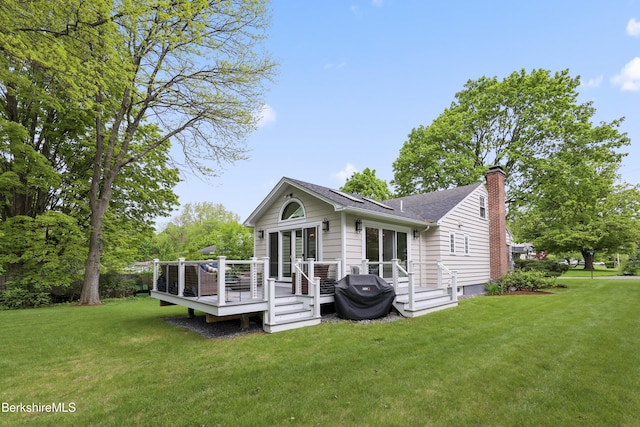 4 Woodlawn Dr, Williamstown, MA 01267 - rear view of house with a chimney, a yard, roof with shingles, and a wooden deck