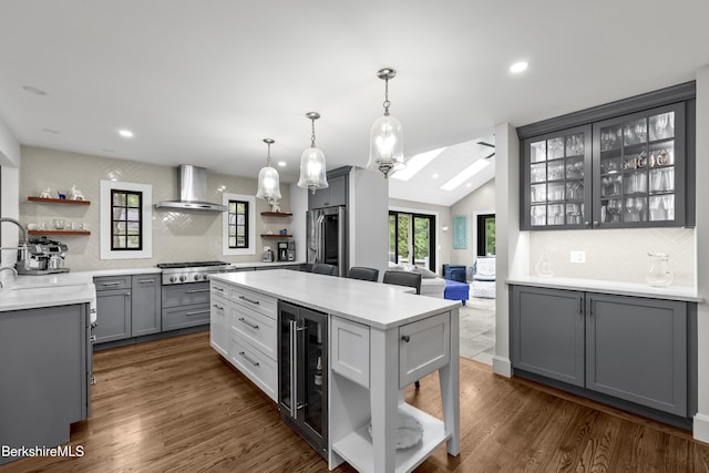 4 Woodlawn Dr, Williamstown, MA 01267 - kitchen featuring wall chimney exhaust hood, open shelves, appliances with stainless steel finishes, wine cooler, and backsplash