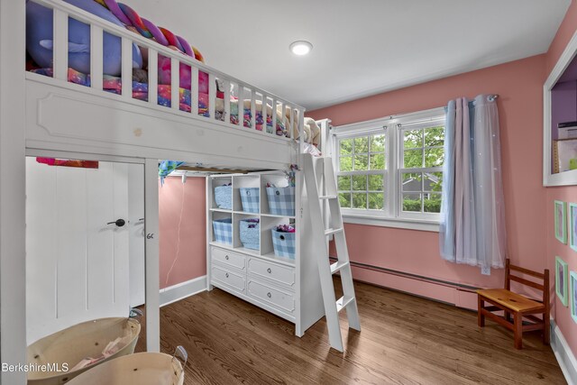 4 Woodlawn Dr, Williamstown, MA 01267 - bedroom featuring baseboard heating, wood finished floors, and baseboards