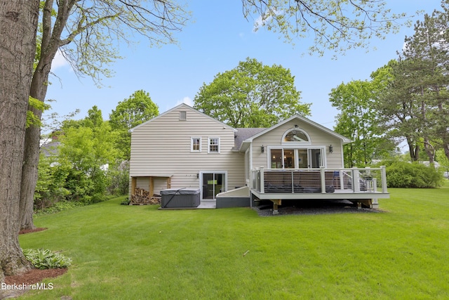 4 Woodlawn Dr, Williamstown, MA 01267 - rear view of house with a hot tub, a deck, and a lawn