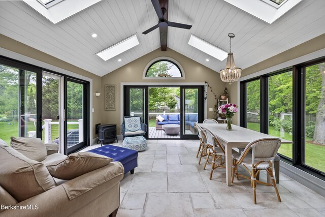 4 Woodlawn Dr, Williamstown, MA 01267 - sunroom featuring a skylight, beam ceiling, stone tile floors, recessed lighting, and a chandelier