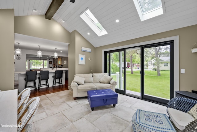 4 Woodlawn Dr, Williamstown, MA 01267 - living room with a skylight, high vaulted ceiling, beamed ceiling, recessed lighting, and stone tile flooring