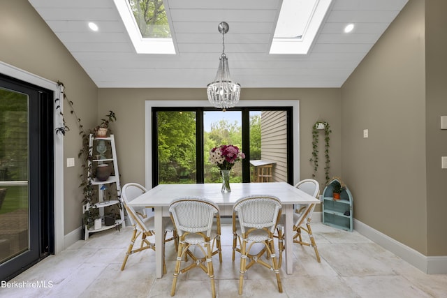 4 Woodlawn Dr, Williamstown, MA 01267 - dining room featuring a skylight, a chandelier, lofted ceiling, and baseboards
