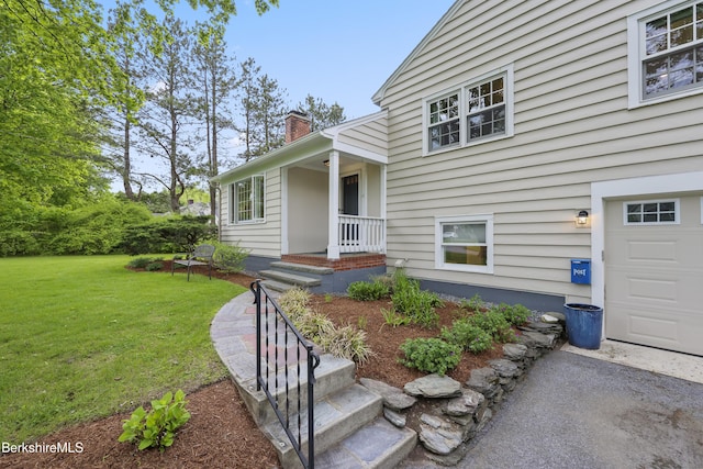 4 Woodlawn Dr, Williamstown, MA 01267 - entrance to property with a chimney, a lawn, and a garage
