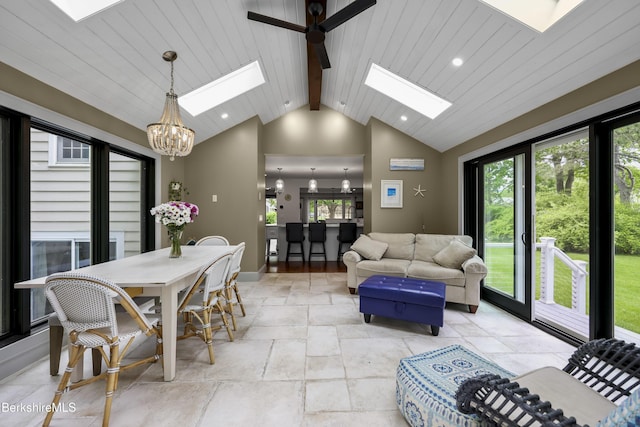 4 Woodlawn Dr, Williamstown, MA 01267 - living area with a skylight, a chandelier, stone tile flooring, baseboards, and recessed lighting