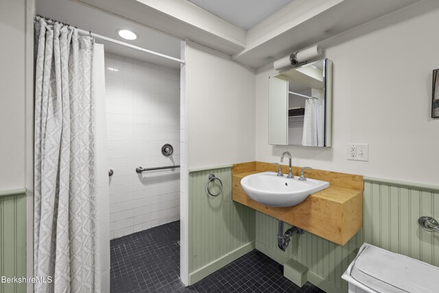 4 Woodlawn Dr, Williamstown, MA 01267 - full bath with a sink, tile patterned flooring, a wainscoted wall, and a shower with curtain