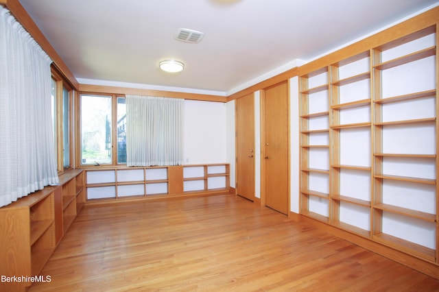 spare room with visible vents and light wood-type flooring