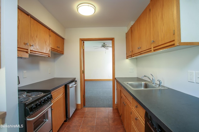 kitchen with a sink, appliances with stainless steel finishes, ceiling fan, and dark countertops