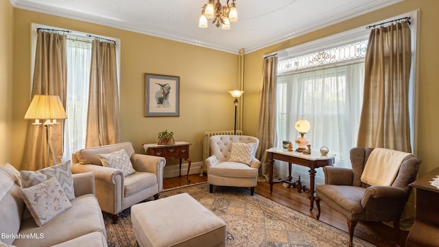 2 Melrose St, Adams, MA 01220 - living area featuring wood finished floors, crown molding, and a chandelier