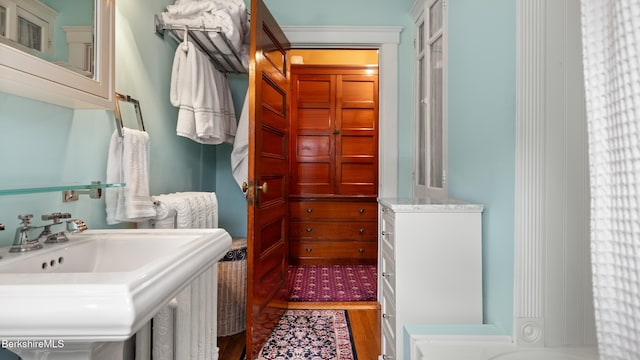 2 Melrose St, Adams, MA 01220 - bathroom featuring a sink and wood finished floors