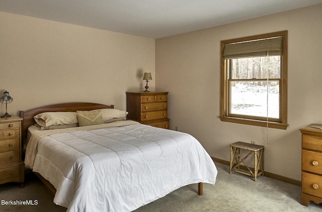 bedroom featuring light carpet