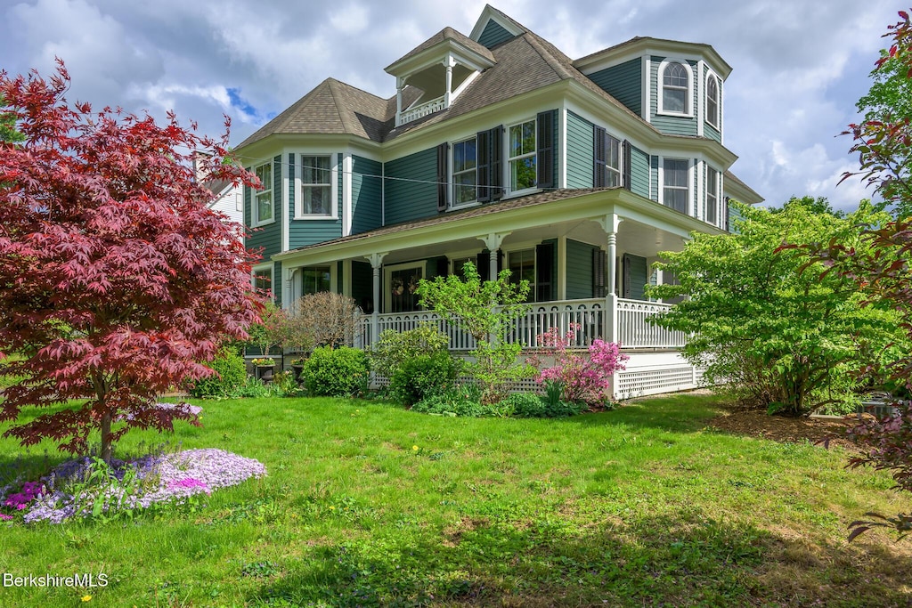 38 Taconic Ave, Lenox, MA 01240 - victorian-style house featuring covered porch and a front lawn