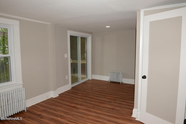 26 Davis St, Pittsfield, MA 01201 - unfurnished room featuring radiator, wood finished floors, and baseboards