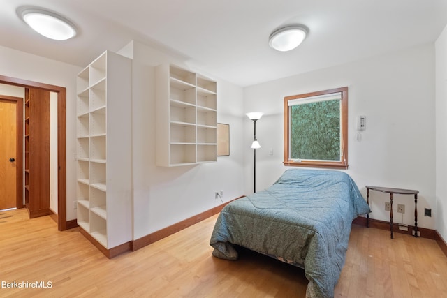 bedroom with wood-type flooring