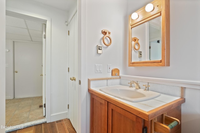 bathroom with hardwood / wood-style floors and vanity