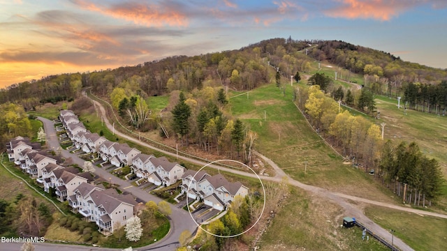 14 Alpine Trl # 14, Pittsfield, MA 01201 - aerial view at dusk featuring a residential view and a view of trees