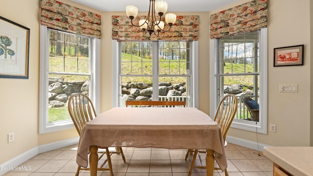 14 Alpine Trl # 14, Pittsfield, MA 01201 - dining room with light tile patterned floors, baseboards, and a notable chandelier