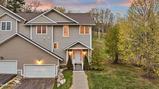 14 Alpine Trl # 14, Pittsfield, MA 01201 - view of front facade with a front yard, roof with shingles, aphalt driveway, and a garage