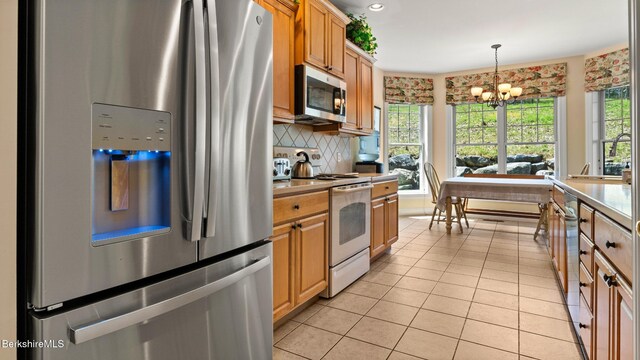 14 Alpine Trl # 14, Pittsfield, MA 01201 - kitchen with an inviting chandelier, appliances with stainless steel finishes, light tile patterned floors, and a sink