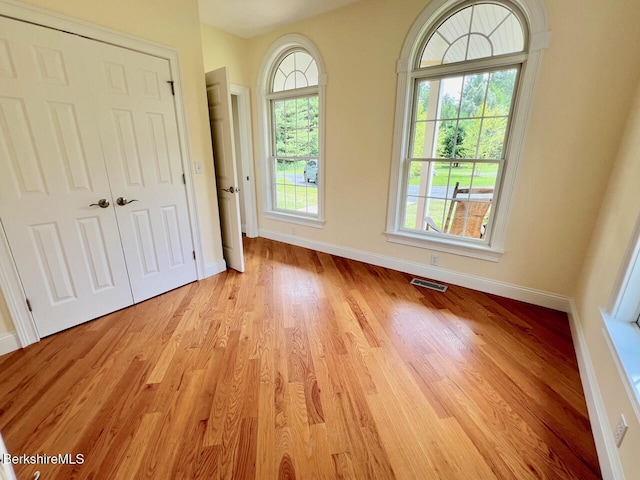 121 E Dugway Rd, Lenox, MA 01240 - unfurnished bedroom with light wood-style flooring and a closet
