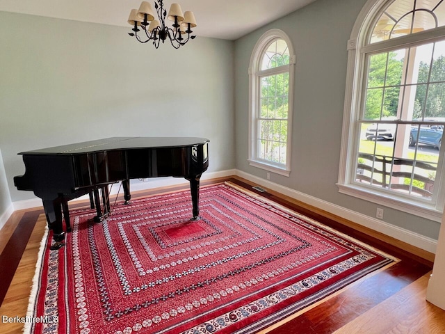 121 E Dugway Rd, Lenox, MA 01240 - living area featuring wood finished floors and a chandelier
