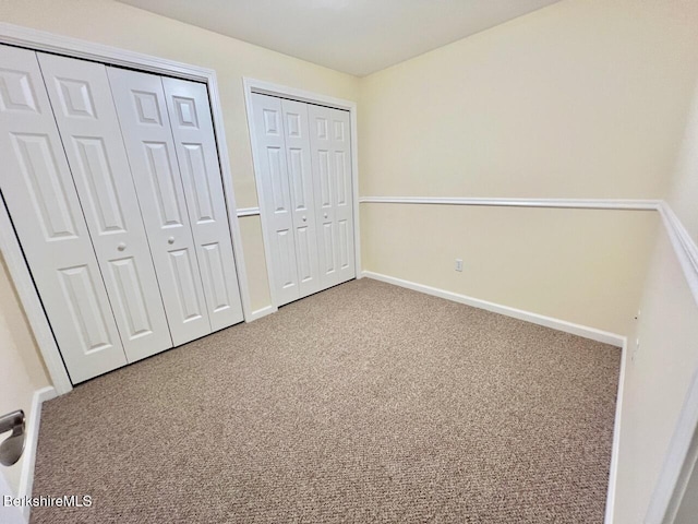 121 E Dugway Rd, Lenox, MA 01240 - unfurnished bedroom with two closets and carpet floors