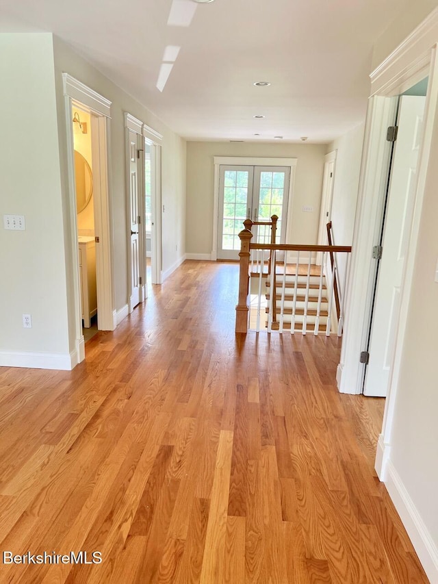 121 E Dugway Rd, Lenox, MA 01240 - hall with light wood-style floors, an upstairs landing, and french doors