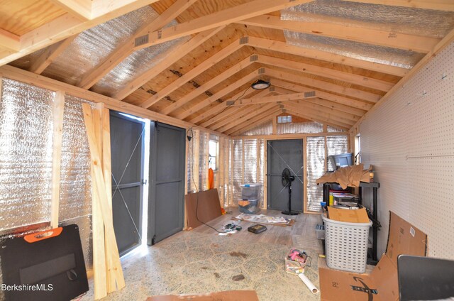 interior space featuring vaulted ceiling