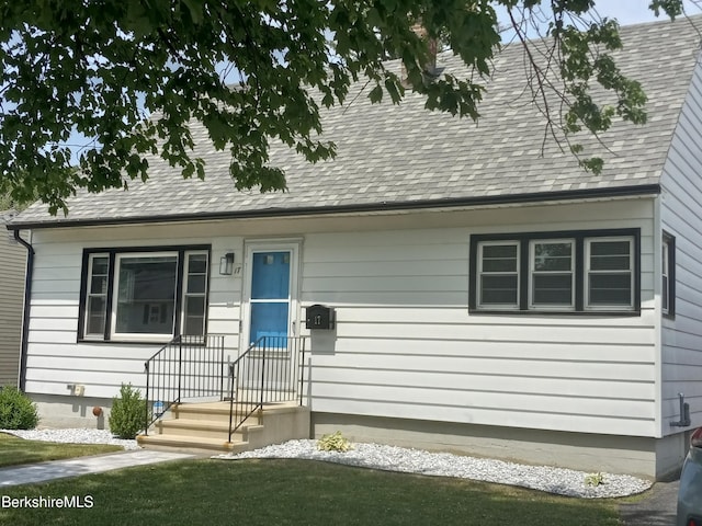 17 Crane Ave, Pittsfield, MA 01201 - cape cod-style house featuring a shingled roof and a front lawn