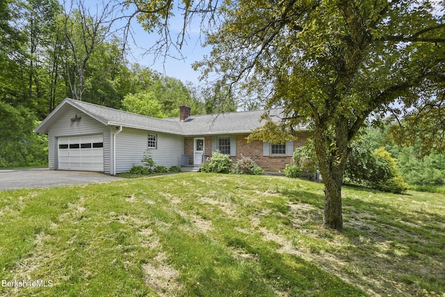 1310 Lenox Rd, Richmond, MA 01254 - ranch-style house with a garage, driveway, a chimney, a front yard, and brick siding