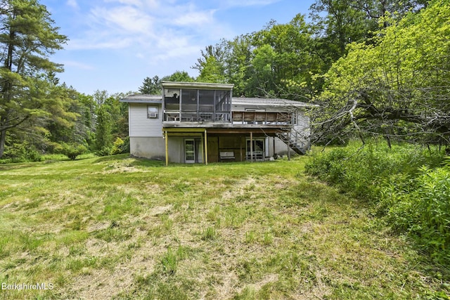 1310 Lenox Rd, Richmond, MA 01254 - back of property with a sunroom, a deck, and a yard