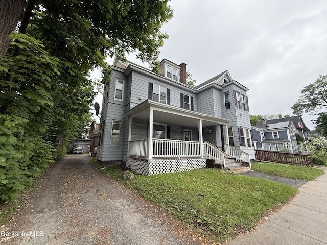 153 First St, Pittsfield, MA 01201 - view of front of home with a porch and a chimney