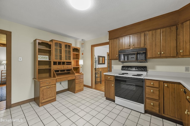 64 Blotz Rd, Washington, MA 01223 - kitchen featuring black microwave, electric range, open shelves, brown cabinets, and light countertops