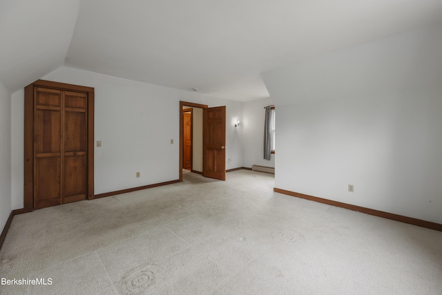 64 Blotz Rd, Washington, MA 01223 - spare room with a baseboard heating unit, light carpet, baseboards, and vaulted ceiling