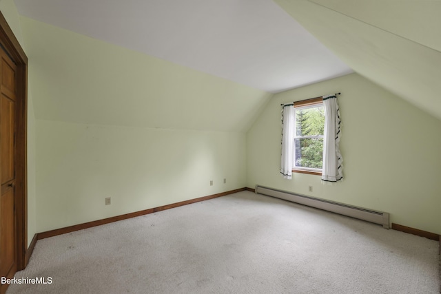 64 Blotz Rd, Washington, MA 01223 - additional living space with baseboard heating, light carpet, vaulted ceiling, and baseboards