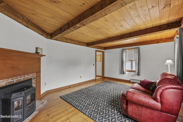 64 Blotz Rd, Washington, MA 01223 - living area with wooden ceiling with exposed beams, hardwood / wood-style flooring, baseboards, a baseboard heating unit, and a wood stove