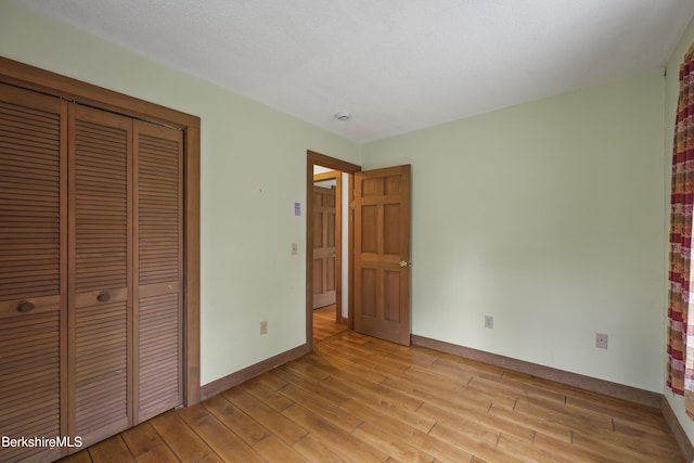 64 Blotz Rd, Washington, MA 01223 - unfurnished bedroom with light wood-style floors, a closet, and baseboards