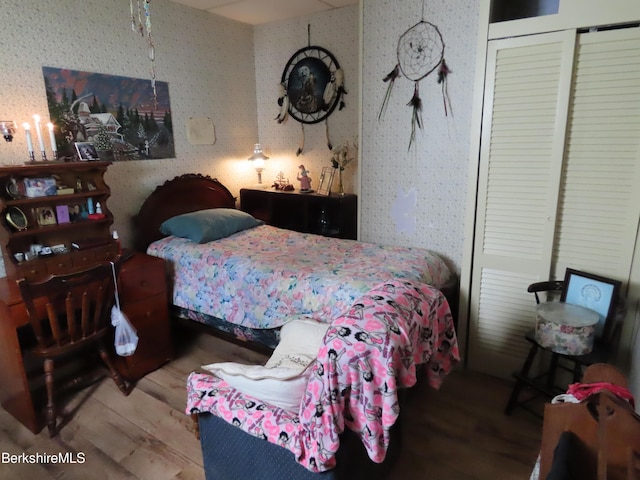 bedroom with wood-type flooring