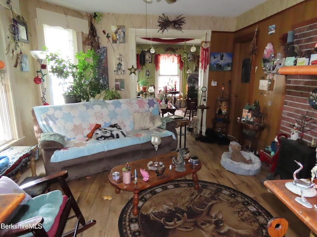 living room with a fireplace, hardwood / wood-style flooring, and plenty of natural light