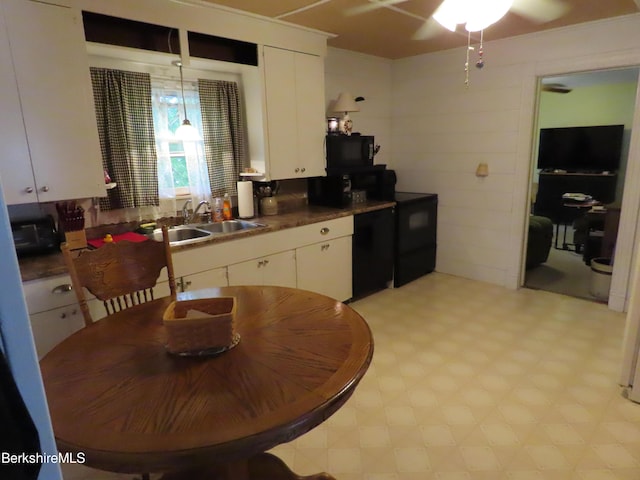 kitchen with white cabinetry, ceiling fan, and sink