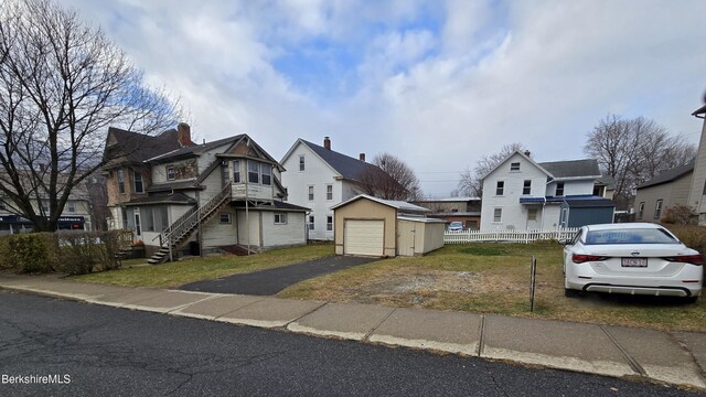 view of front of property with an outbuilding and a garage