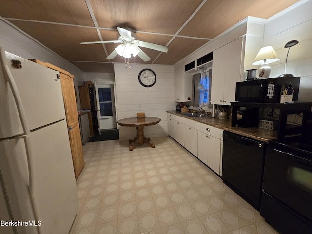 kitchen featuring wood ceiling, wooden walls, black appliances, white cabinetry, and hanging light fixtures