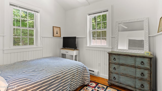 25 Pine St, New Marlborough, MA 01230 - bedroom featuring wood finished floors, a wainscoted wall, and a baseboard heating unit