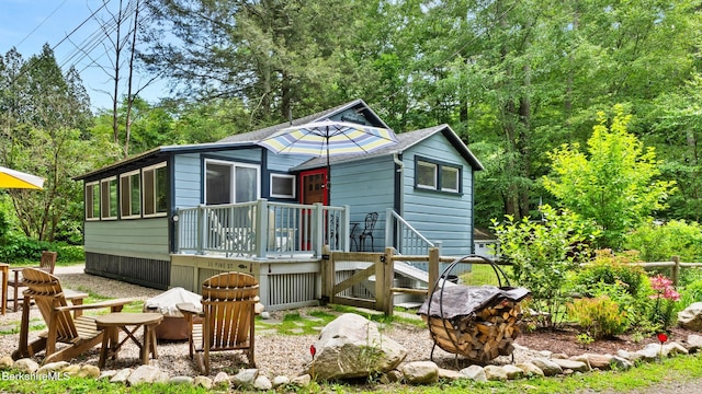 25 Pine St, New Marlborough, MA 01230 - view of front of house featuring an outdoor fire pit and a wooden deck