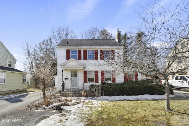 view of front of home with a chimney