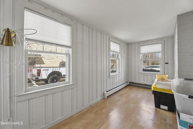 interior space with baseboard heating and light wood-style flooring