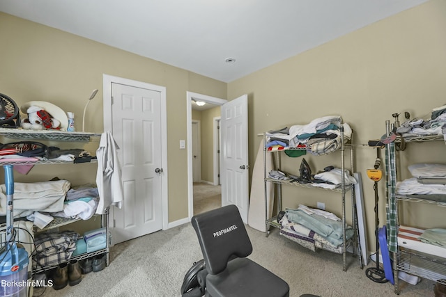 workout area with carpet floors and baseboards