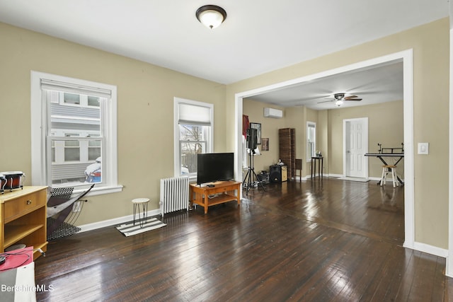 living area with radiator heating unit, baseboards, dark wood finished floors, and a ceiling fan